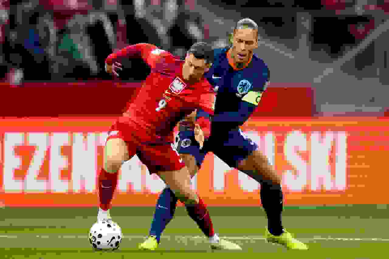 Robert Lewandowski and Virgil van Dijk fighting for a ball during the Poland vs Netherlands FIFA World Cup 2026 qualifiers